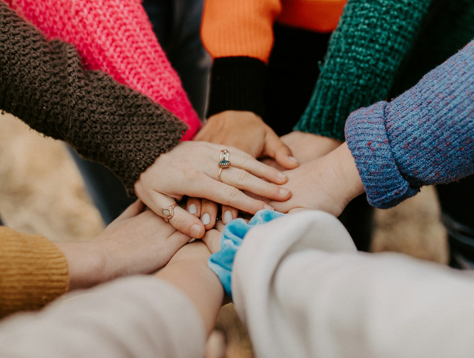 People stacking hands