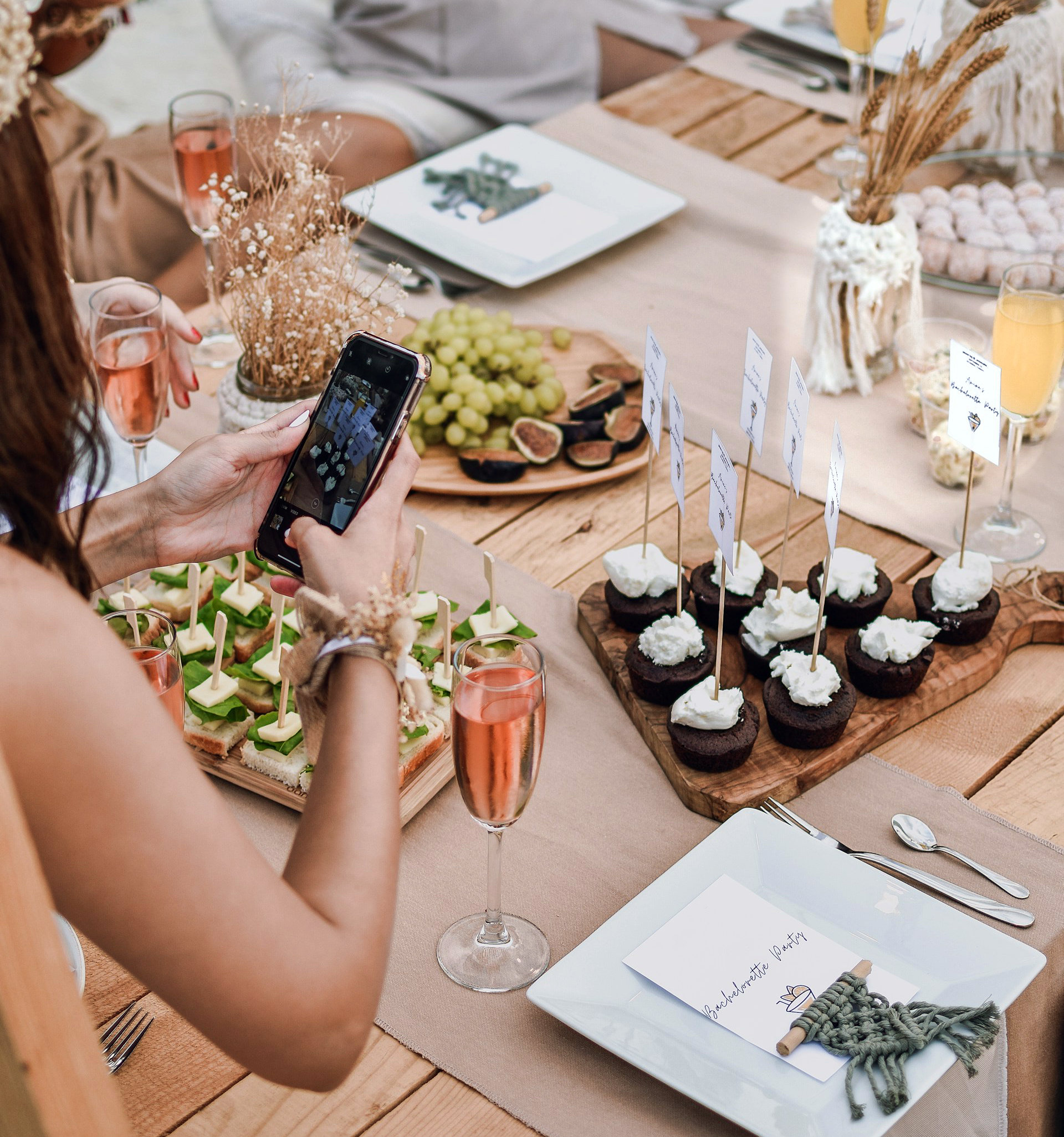 Person taking photos of food for social media