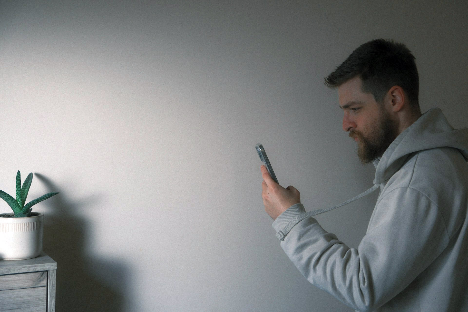 Person scrolling on their phone