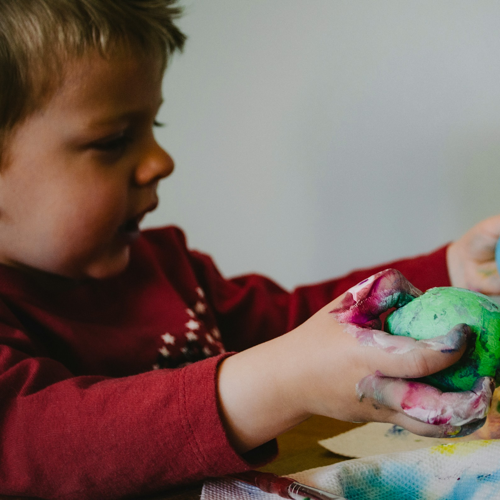 Toddler playing with clay